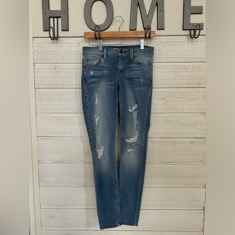 Guess low-rise distressed skinny jeans in med wash
